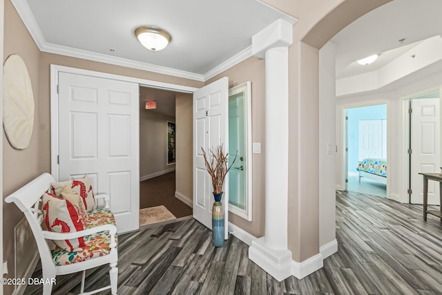 hallway with ornamental molding and dark wood-type flooring