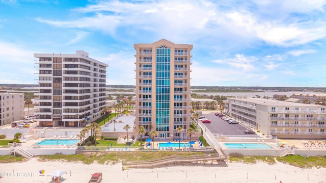 view of building exterior with a community pool