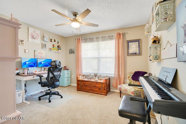 office area featuring ceiling fan, light colored carpet, and a textured ceiling