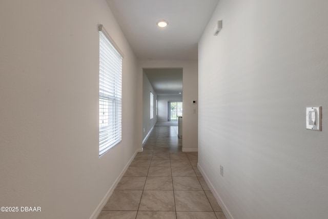 hallway with light tile patterned floors