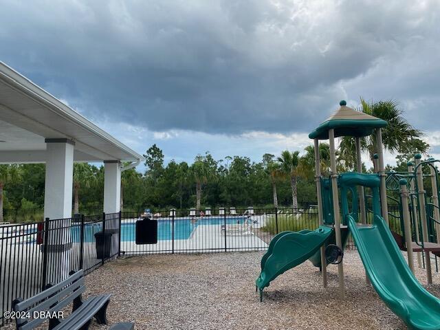 view of play area with a community pool