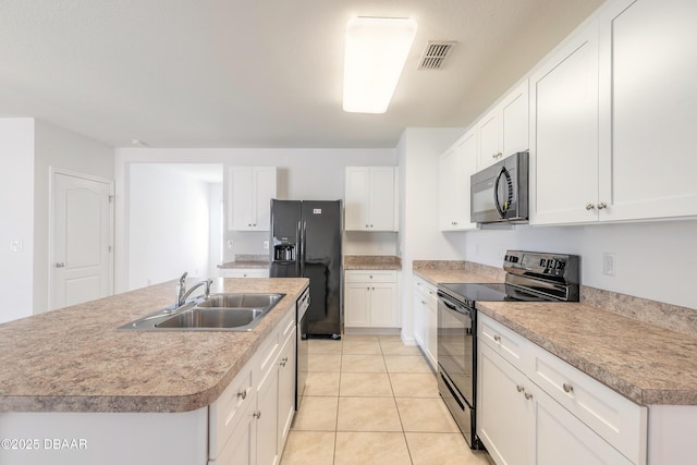 kitchen with sink, a center island with sink, white cabinets, and black appliances