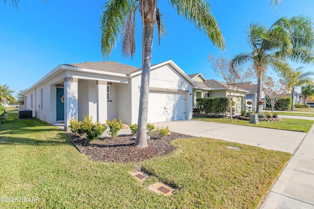 ranch-style home with central AC, a front yard, and a garage