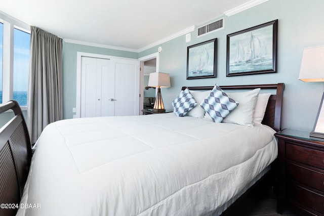 2625 S Atlantic Ave Unit 8Ne, Daytona Beach, FL 32118 - bedroom with crown molding and a closet
