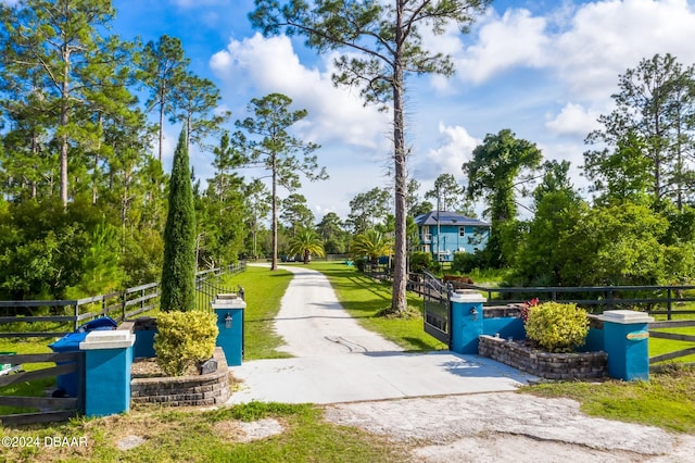 view of home's community featuring a lawn