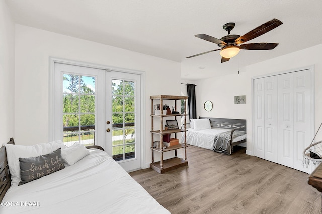 bedroom with ceiling fan, light hardwood / wood-style floors, access to exterior, and french doors