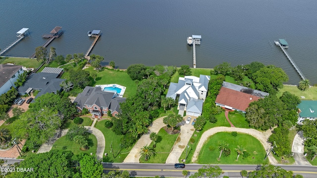 birds eye view of property with a water view