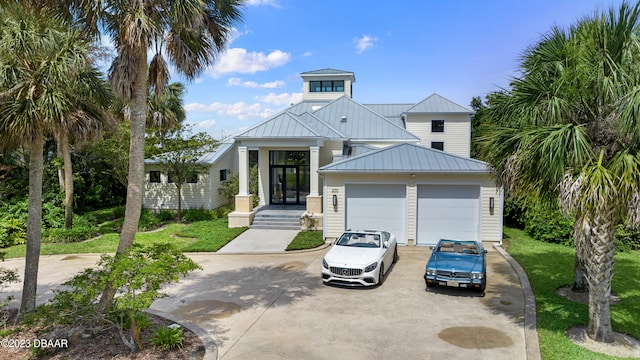 view of front of property featuring a garage and a front yard