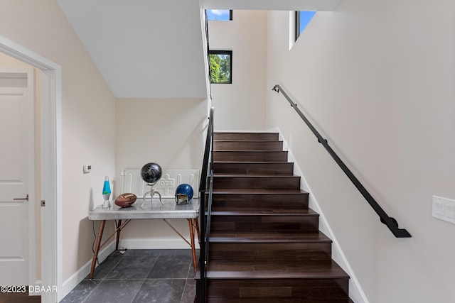 staircase with tile patterned floors