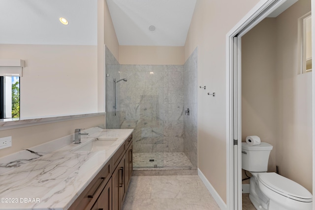 bathroom with toilet, vanity, vaulted ceiling, and a tile shower