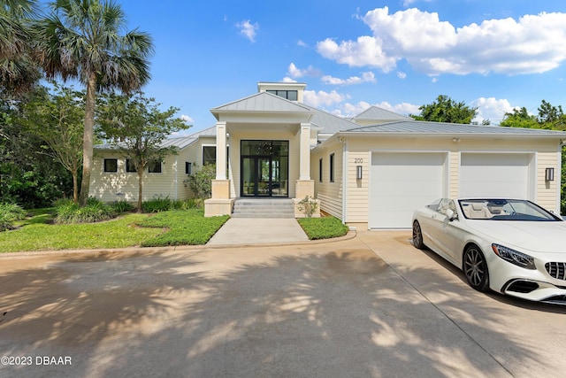 200 John Anderson Dr, Ormond Beach, FL 32176 - view of building exterior featuring concrete driveway and a garage