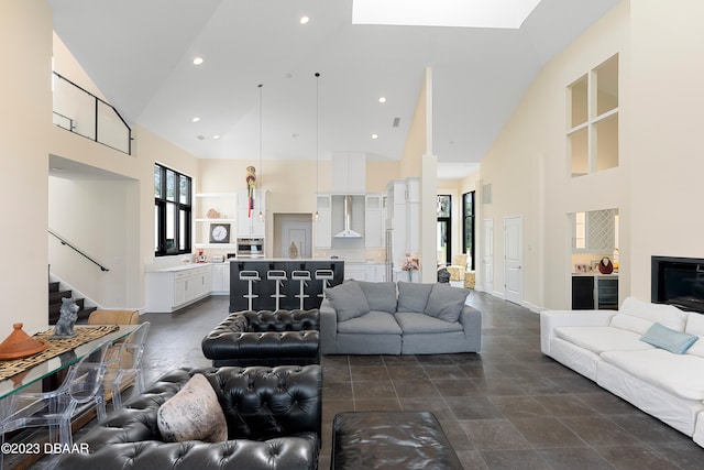 living room with high vaulted ceiling