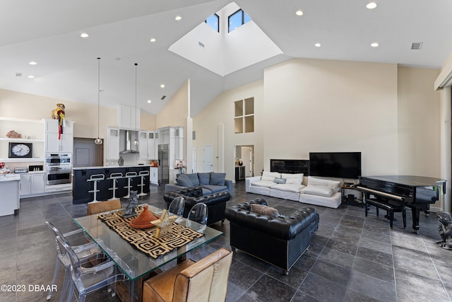 living room with high vaulted ceiling