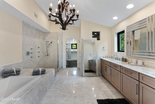 bathroom featuring plus walk in shower, a notable chandelier, vanity, and vaulted ceiling