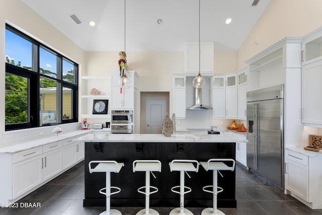 200 John Anderson Dr, Ormond Beach, FL 32176 - kitchen with appliances with stainless steel finishes, wall chimney exhaust hood, vaulted ceiling, a kitchen island, and open shelves