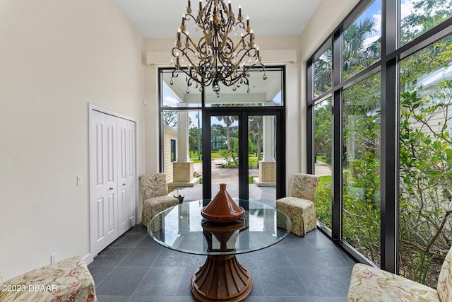 sunroom with a notable chandelier