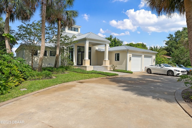 view of front facade with a garage and a porch