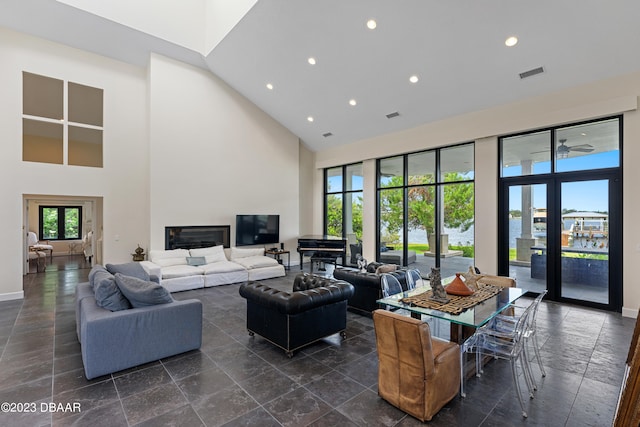 living room with a towering ceiling