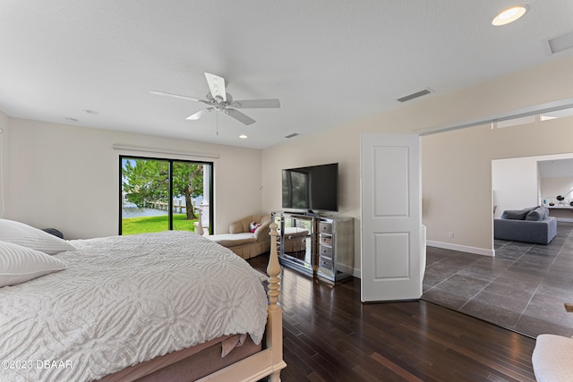 bedroom featuring ceiling fan, access to exterior, and dark hardwood / wood-style flooring