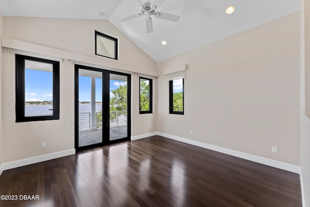 unfurnished room featuring ceiling fan, dark hardwood / wood-style floors, french doors, and high vaulted ceiling