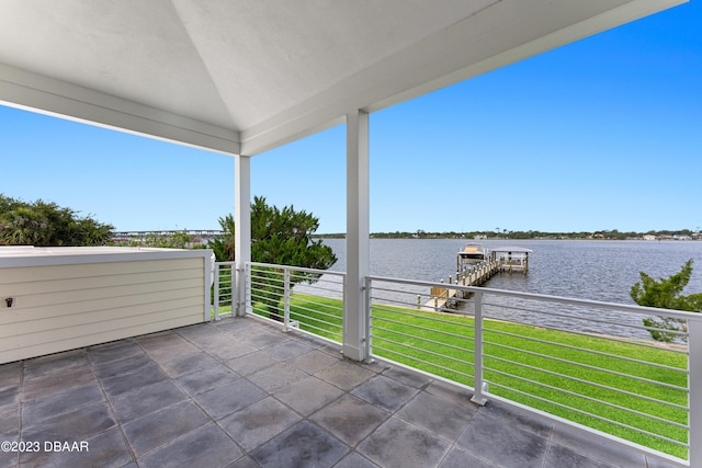 view of patio / terrace with a water view and a balcony