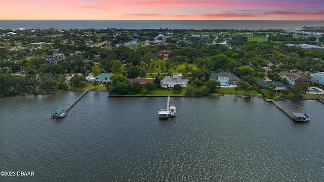 aerial view at dusk with a water view