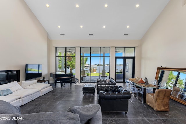 living room with plenty of natural light and vaulted ceiling