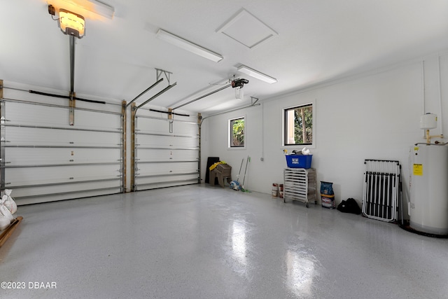 garage featuring a garage door opener and electric water heater