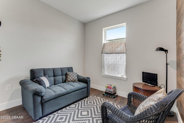 living room with wood finished floors and baseboards
