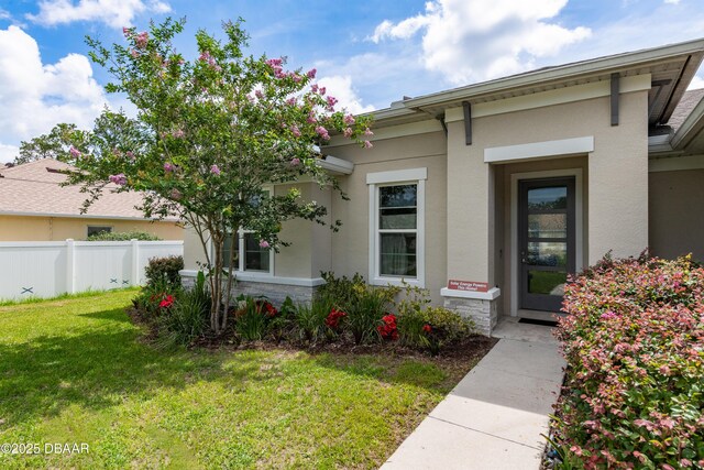 19 Russman Ln, Palm Coast, FL 32164 - entrance to property with stucco siding
