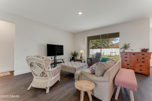 living area with dark wood finished floors, recessed lighting, and baseboards