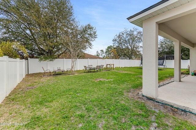view of yard featuring a patio area and a fenced backyard