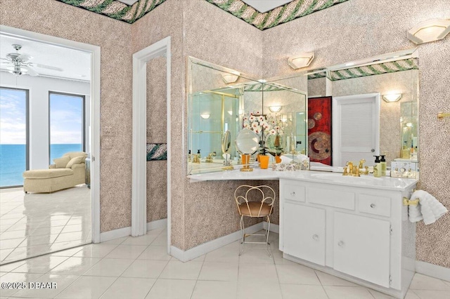 915 Ocean Shore Blvd Unit 801, Ormond Beach, FL 32176 - full bath featuring vanity, a ceiling fan, tile patterned floors, baseboards, and a water view