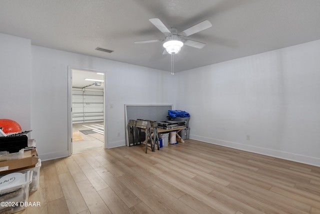 misc room with ceiling fan and light hardwood / wood-style flooring