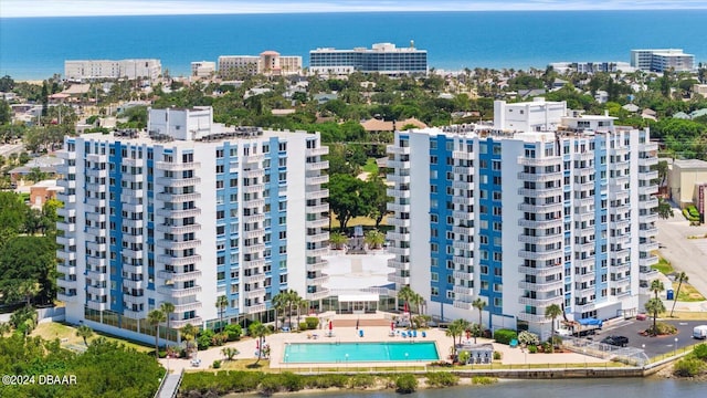 birds eye view of property with a water view