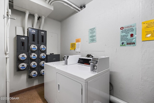 washroom with electric panel and washing machine and dryer