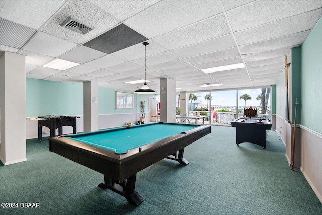 game room featuring a paneled ceiling, pool table, carpet flooring, and a healthy amount of sunlight