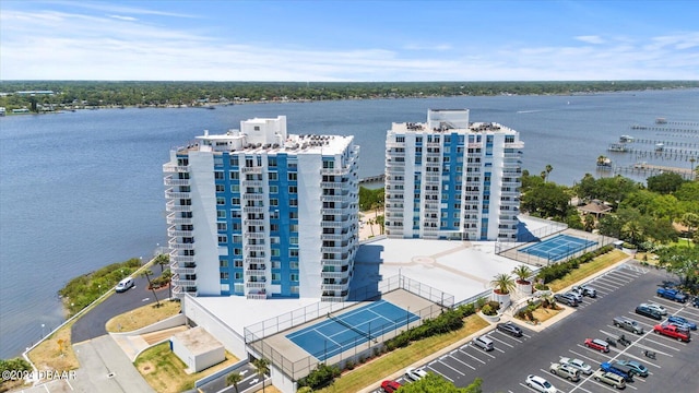 birds eye view of property with a water view