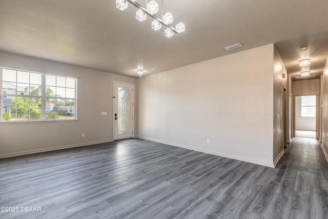 117 Boysenberry Ln, Daytona Beach, FL 32124 - interior space featuring baseboards, dark wood-style floors, and a chandelier