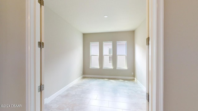 empty room featuring light tile patterned floors