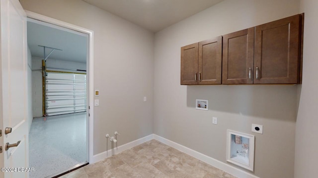 clothes washing area with cabinets, washer hookup, hookup for a gas dryer, and hookup for an electric dryer