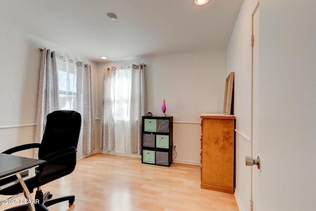 office with recessed lighting and wood finished floors