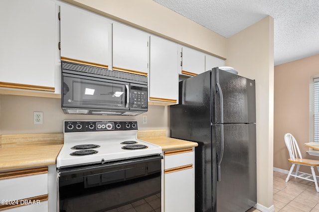 kitchen with black appliances, white cabinetry, a textured ceiling, and light tile patterned floors