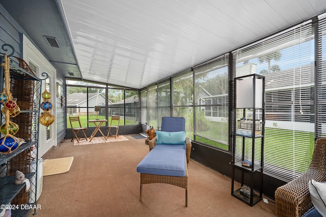 sunroom / solarium with vaulted ceiling