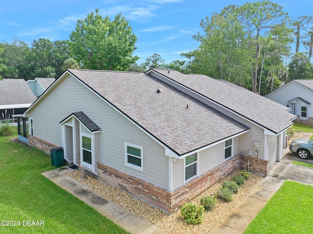 view of property exterior with a lawn