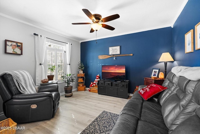 living room featuring ceiling fan, light hardwood / wood-style floors, and ornamental molding