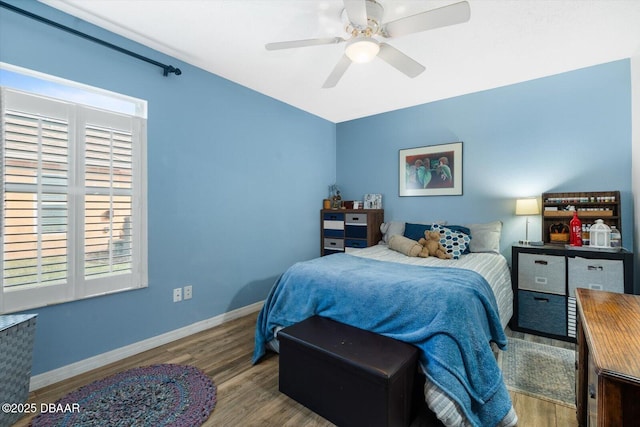 bedroom featuring ceiling fan and light hardwood / wood-style flooring