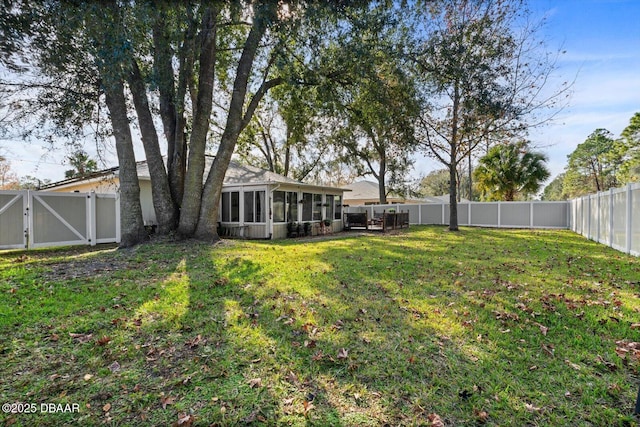 view of yard featuring a sunroom