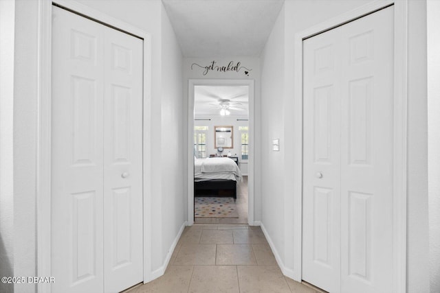 corridor featuring light tile patterned floors