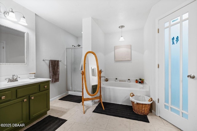 bathroom featuring tile patterned floors, vanity, and separate shower and tub